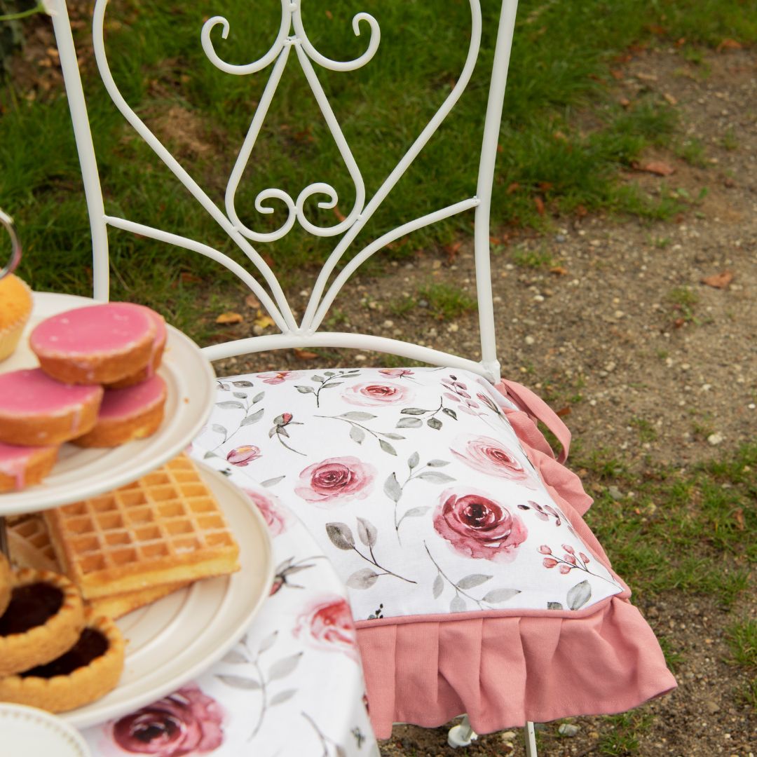 Photo of a picnic with kitchen textiles with a strawberry print
