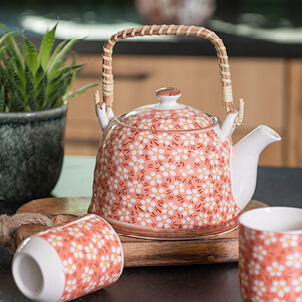 Teapot with floral print.
