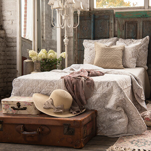 Shabby Chic bed with a hat.
