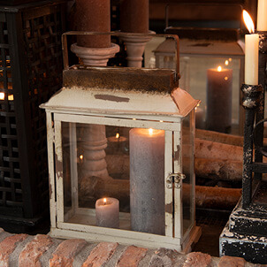 White lantern with candles.