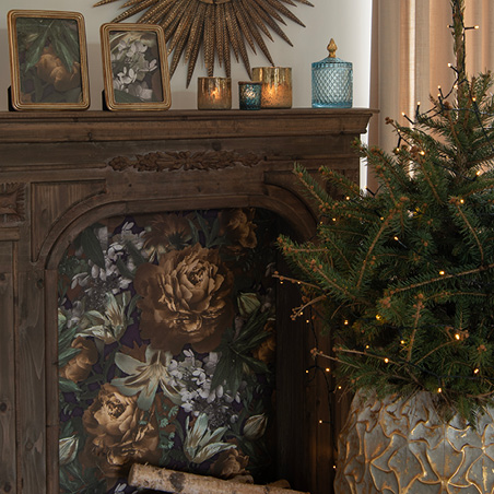 Wooden mantelpiece with wallpaper as a backdrop