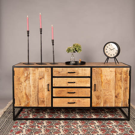 A cabinet, candleholders, a tray, a vase, a rug, and a clock.
