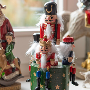An image of two nutcrackers with a red and white color scheme. At the bottom of the image is a button labeled 'Christmas,' linking to the Christmas page.
