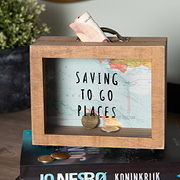 A wooden piggy bank with coins inside