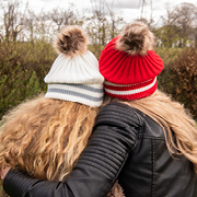 Mother and daughter with a winter hat on