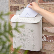 A rustic metal mailbox