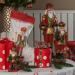 A Christmas stocking with a red-wrapped gift and two red nutcrackers