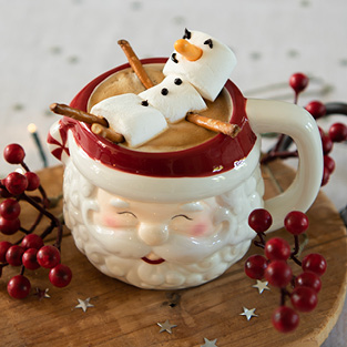 A Santa Claus mug with a marshmallow figure inside