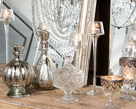 A classic style includes many accessories with glossy accents, such as tealight holders and vases